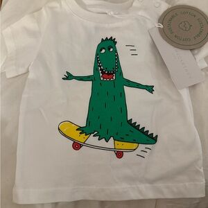 Stella McCartney Kids White Tee with Green Dinosaur on Skateboard